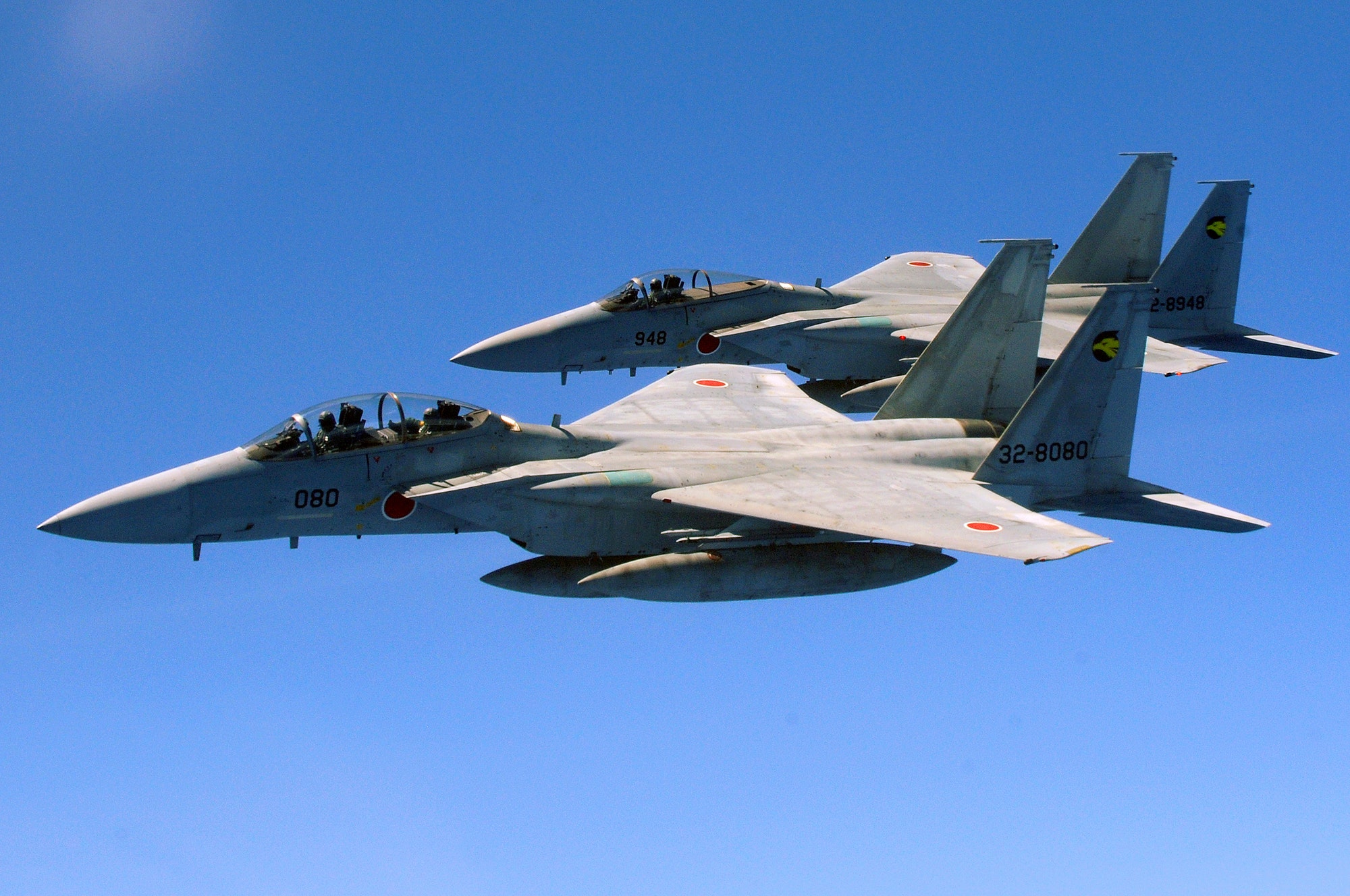 Two Japanese Air Self Defense Forces F-15's fly alongside a U.S. Air Force KC-135 from the 909th Air Refueling Squadron, Kadena Air Base, during air refueling training July 30. The training is in preparation for JASDF participation in Red Flag Alaska this year. (U.S. Air Force photo/Tech. Sgt. Angelique Perez)