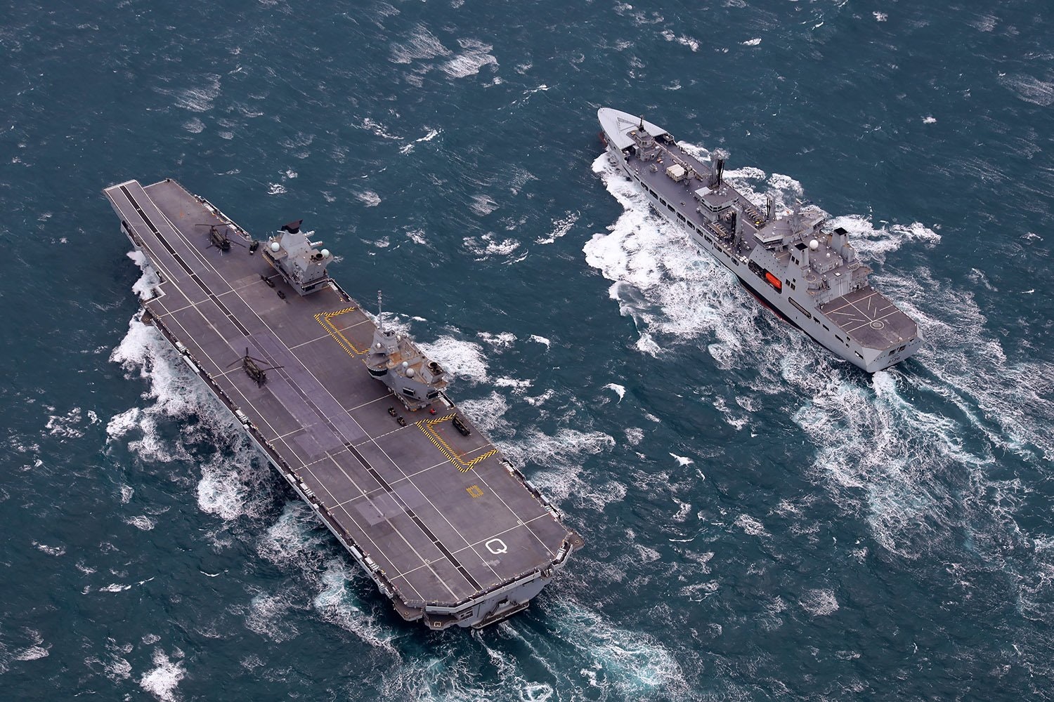 IN PICTURES: HMS Queen Elizabeth and RFA Tidespring meet up for carriers first Replenishment at Sea
